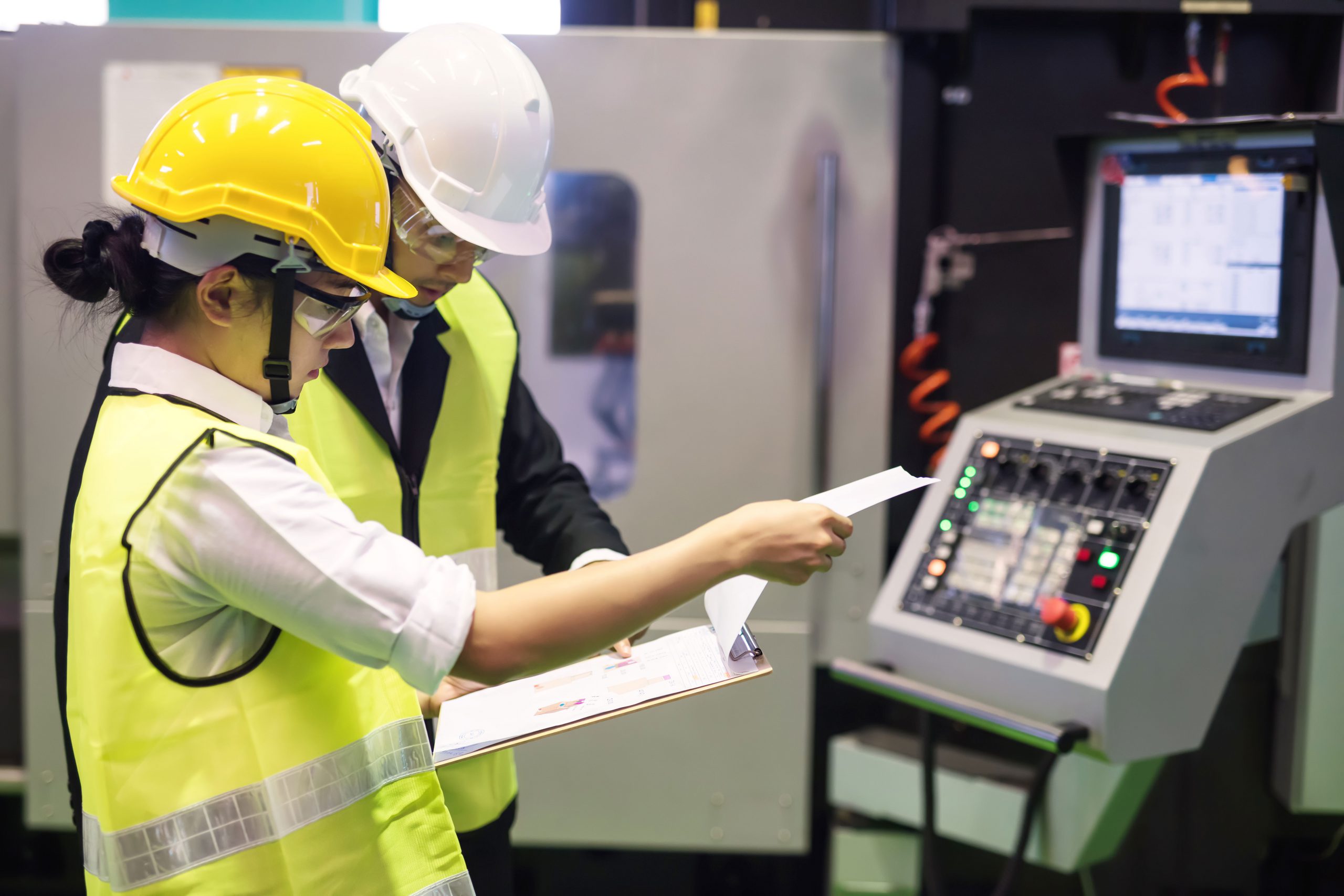 Проверка макета. Young quality Inspector working in Factory. Inspection on the Plant field. Qualified personnel. Personnel Cantrol.